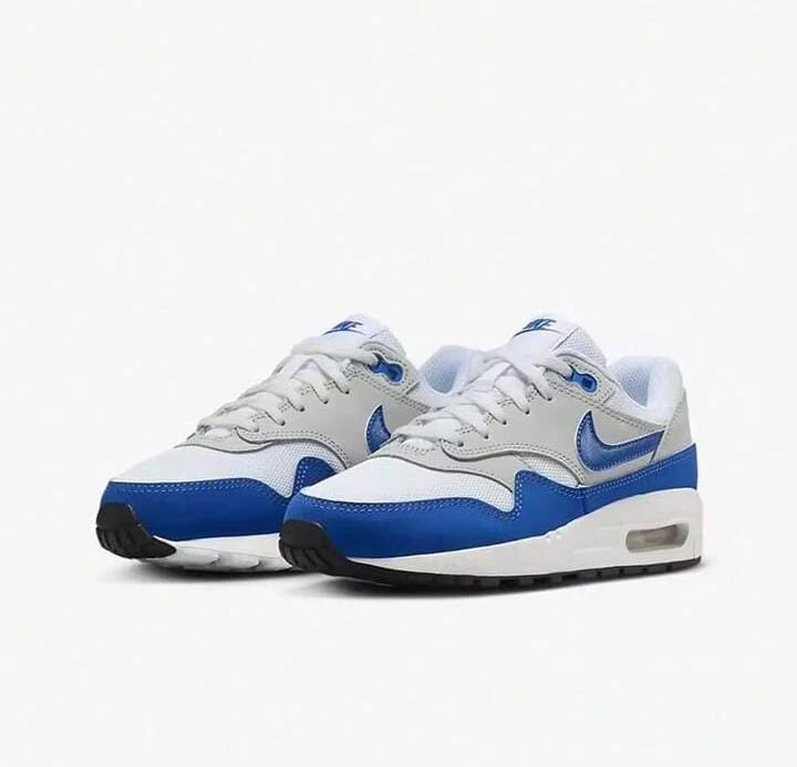 Pair of gray and blue sneakers on a white background